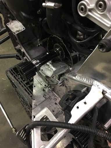2000 Ford E350 - A close-up view of a snowmobile's drivetrain components, showing the drive shaft and clutch mechanism.