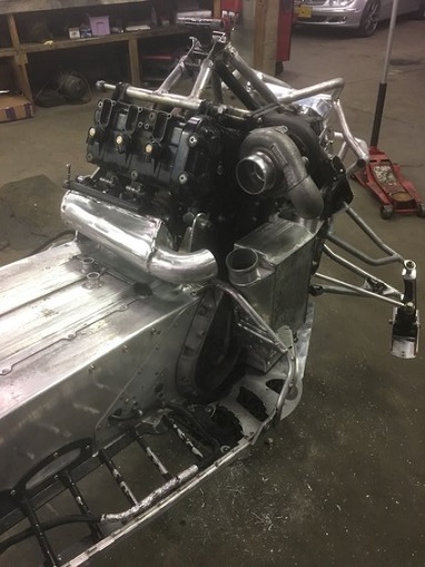 2000 Ford E350 - Custom snowmobile chassis undergoing modification with a V8 engine and turbo.