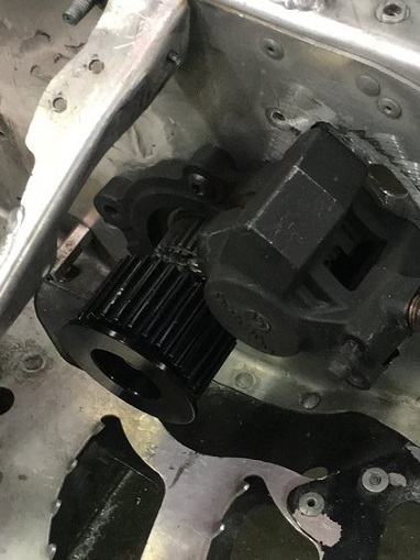 2000 Ford E350 - Detail of a snowmobile's drive pulley and brake caliper, showing mechanical components.
