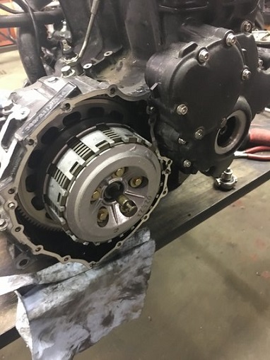 2000 Ford E350 - The internal components of a motorcycle's clutch are visible, with a greasy rag underneath.