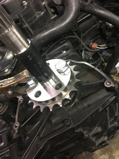 2000 Ford E350 - A close-up view of a metal sprocket and shaft assembly, likely part of an engine or transmission system.