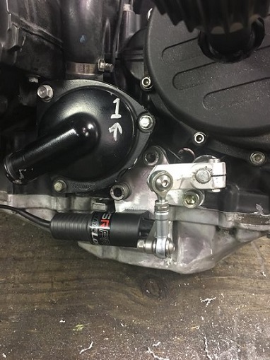 2000 Ford E350 - Detail of engine components including a shifter linkage and a thermostat housing.