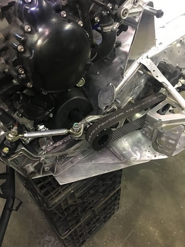 2000 Ford E350 - Close-up view of a snowmobile engine and drivetrain, a Gates Poly Chain belt and drive sprocket.