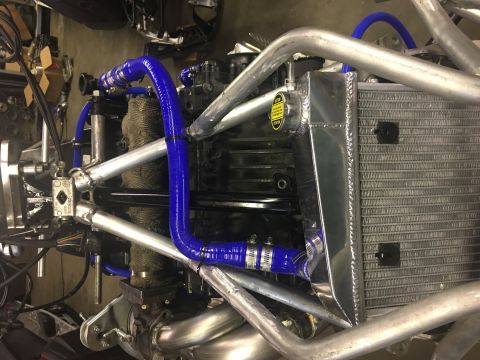 2000 Ford E350 - Custom engine setup with a new radiator and blue silicone hoses.