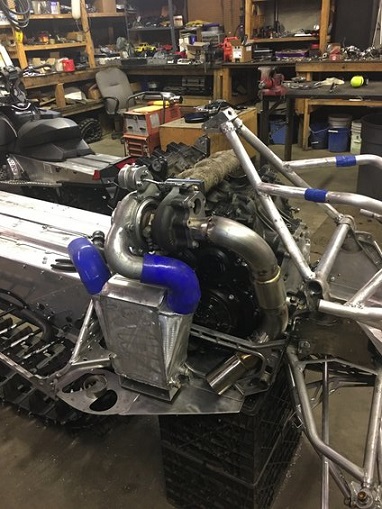 2000 Ford E350 - Custom engine and chassis components are assembled in a workshop environment.