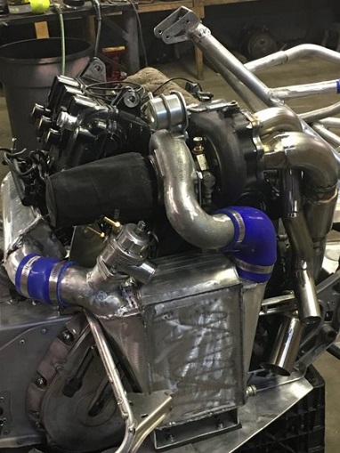 2000 Ford E350 - Custom turbocharger setup with intercooler and wastegate visible.