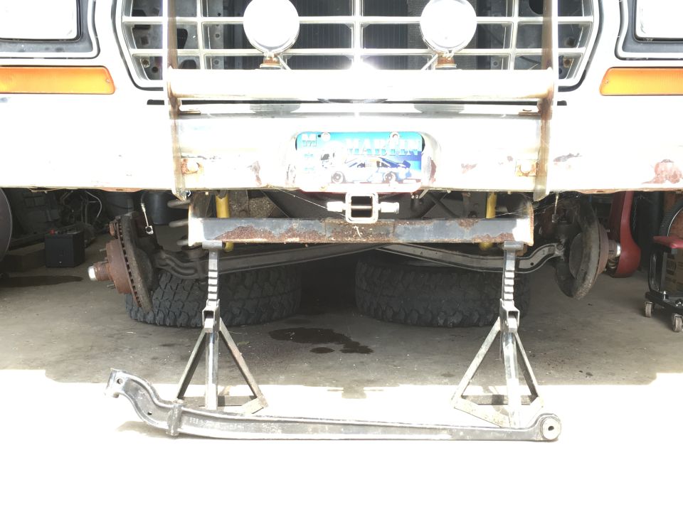 truck front end on jack stands with leaf spring removed