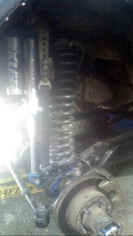 1978 Ford Bronco - Vehicle suspension components, including a Fox Racing Shox shock absorber and coil spring, are visible.