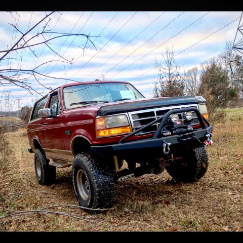 1995 Ford Bronco - This 1995 Ford Bronco is equipped with a winch and heavy-duty bumper, ready for off-road adventures.