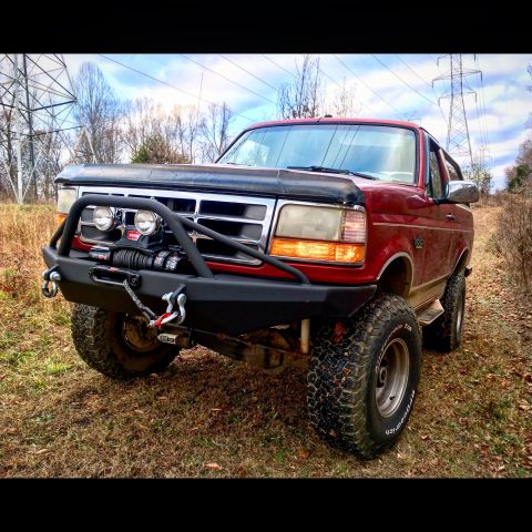 1995 Ford Bronco - This 1995 Ford Bronco features a custom winch bumper and BFGoodrich tires, ready for off-road adventures.