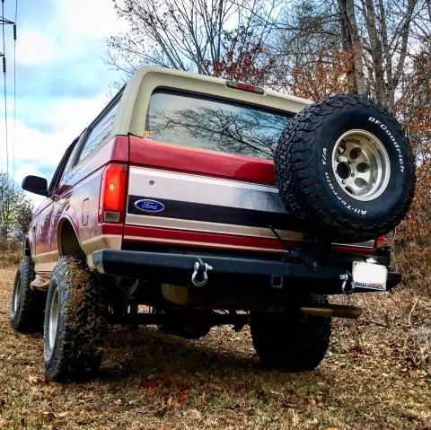 1995 Ford Bronco - Rear view of a 1995 Ford Bronco showing its spare tire and aftermarket bumper.
