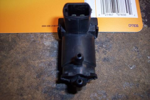 1995 Ford Bronco - This black windshield washer pump has visible part numbers 0004-000-3148 R and CP7830 printed on its packaging.