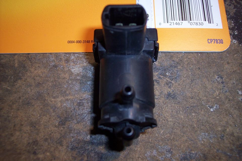 Black windshield washer pump with part numbers 0004-000-3148 R and CP7830 visible