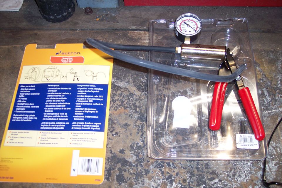 Actron vacuum pump and gauge kit with red-handled pliers