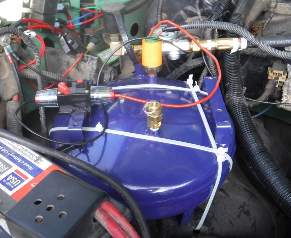 Tank secured in crude but effective fashion, inline circuit breaker lined up (awaiting a proper mount; will shorten the wires at that point), temporary water proofing added to the pressure switch.