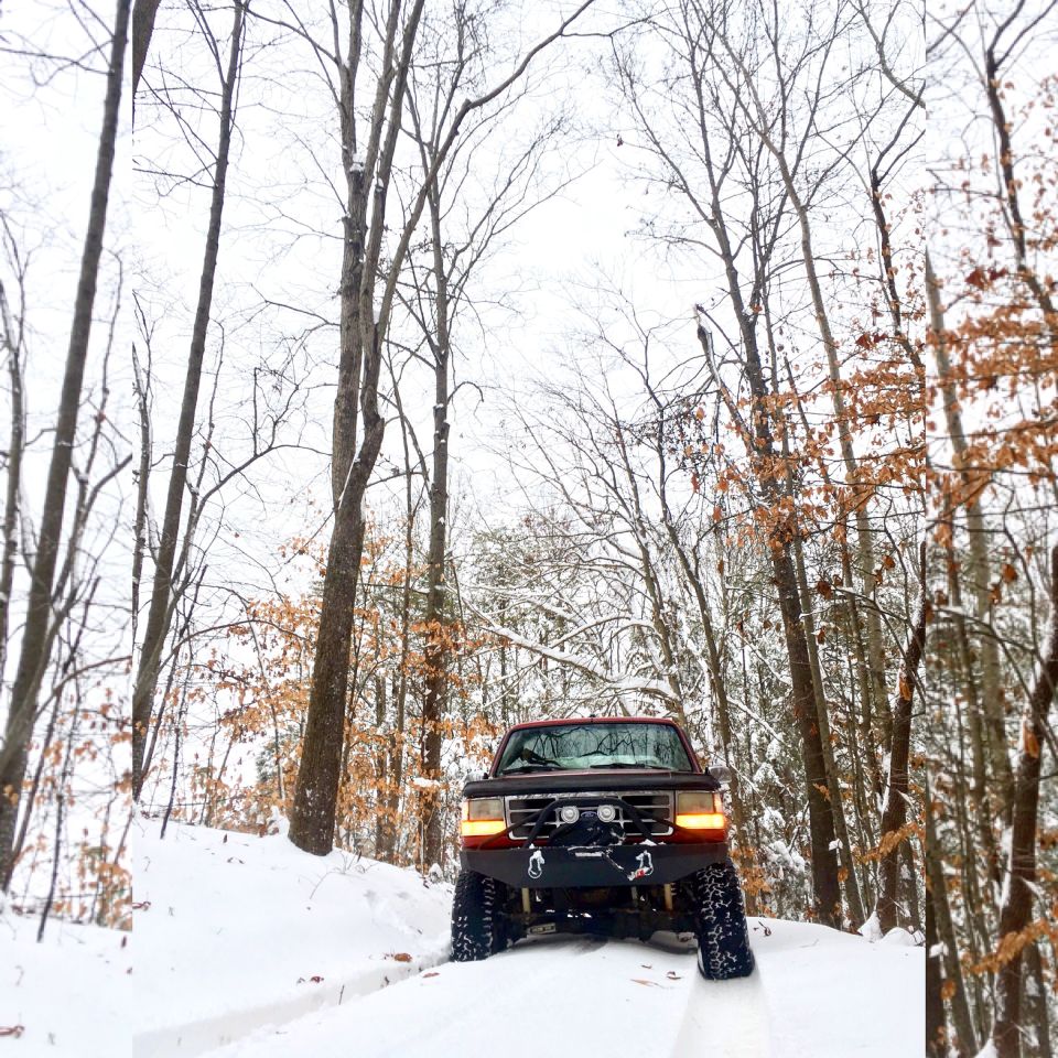 1995 Ford Bronco front view in snow with winch and aftermarket bumper