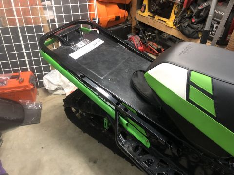 2019 Arctic Cat Mountain Cat 800 - Snowmobile rear section with green frame and patterned seat.