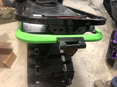 2019 Arctic Cat Mountain Cat 800 - This image shows a detailed view of a snowmobile's track and suspension components, highlighting the mechanical parts.