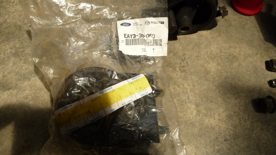 Mazda engine mount part EAY3-39-050 in plastic packaging