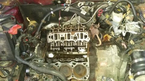 2000 Pontiac Grand Prix - Engine block and cylinder head removed, exposing internal components for repair or inspection.