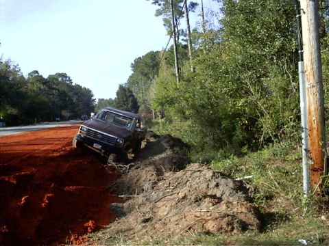 1985 Ford Bronco - This 1985 Ford Bronco appears to be stuck in a dirt embankment.