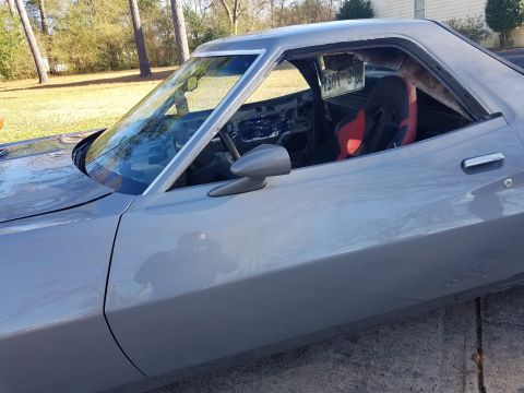 1976 Ford Ranchero - This 1972 Ford Ranchero shows a racing seat and a license plate visible through the window.
