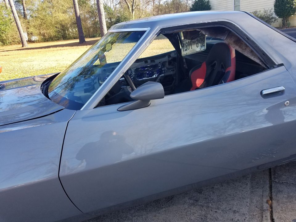 Gray 1972 Ford Ranchero with racing seat, viewed from the side