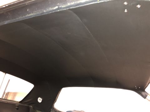 1968 Mercury Cougar - Interior view of a 1968 Mercury Cougar, focusing on the headliner and rear window area.