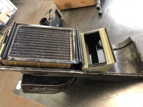 1968 Mercury Cougar - Disassembled car heater core and blower assembly with foam insulation.