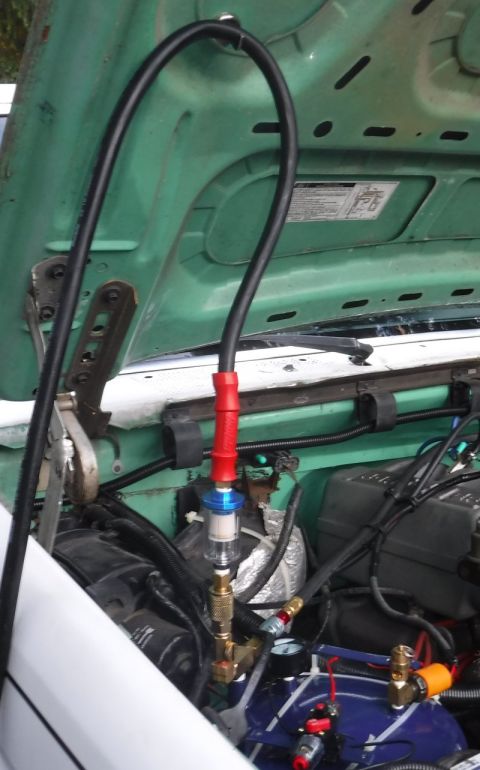 1992 Ford Bronco - K.I.S.S. hose and fittings strain relief, using a magnet hook.