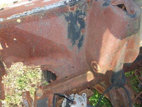 1970 Ford Torino - This 1970 Ford Torino shows significant rust in the engine bay, indicating extensive deterioration.