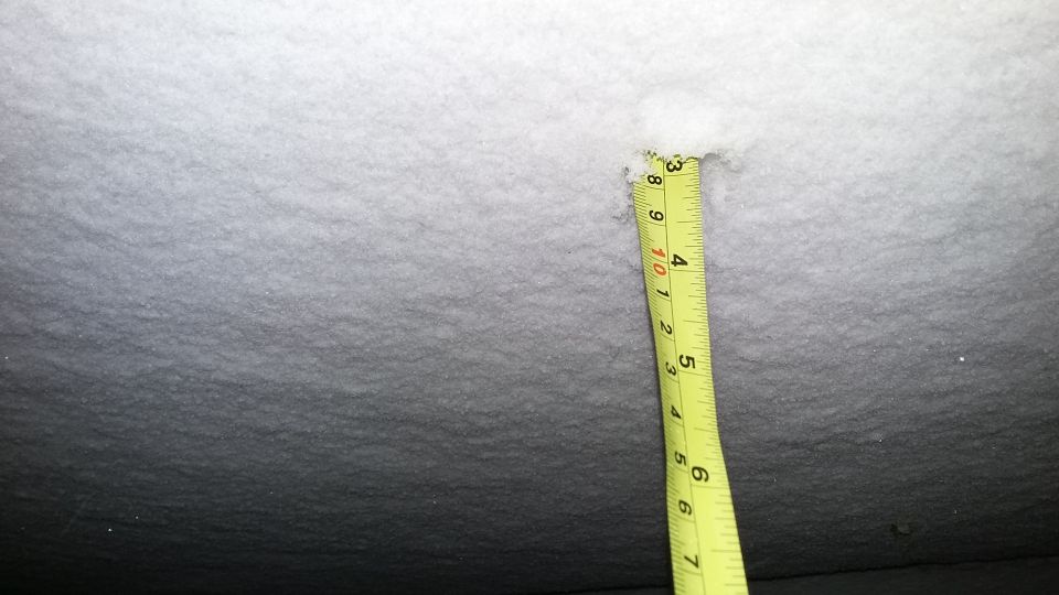 Measuring tape in snow