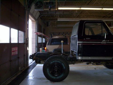 1978 Ford Bronco - A Ford Bronco body is being worked on, with another SUV visible in the background.
