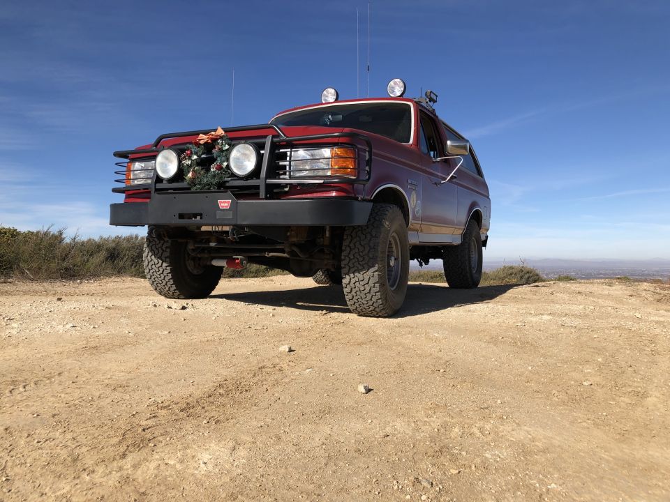 1989 Ford Bronco front view in desert landscape