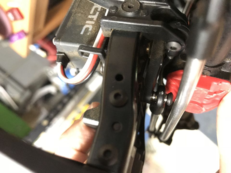 Close-up of RC car servo motor and linkage mechanism