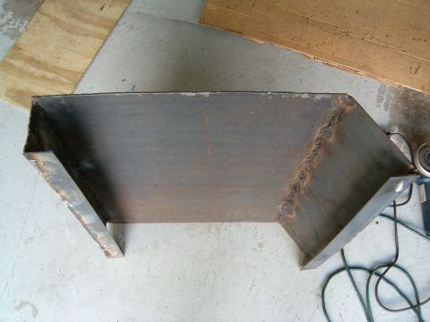 1979 Ford Bronco - Custom metal skid plate, likely for off-road use, shown before installation.