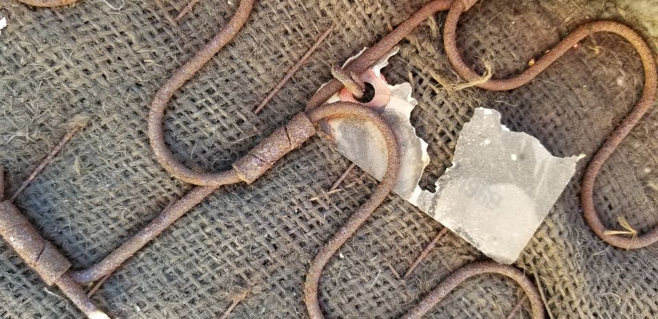 close-up of rusty seat springs on burlap upholstery