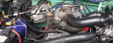 1992 Ford Bronco - Compressor plumbing finalized with Rotolock flange fitting on discharge port, and SS braided, teflon lined hose all the way to the tank.