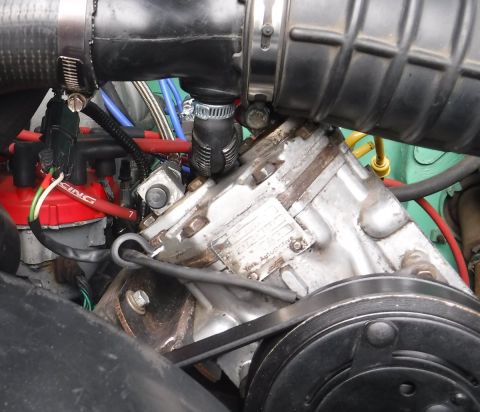 1992 Ford Bronco - Compressor plumbing finalized with Rotolock flange fitting on discharge port, and SS braided, teflon lined hose all the way to the tank. Th…