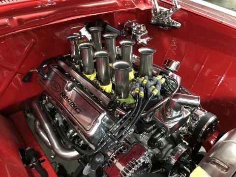 1964 Ford Fairlane - A highly polished Ford Racing V8 engine is installed in a red vehicle. The engine features individual throttle bodies, chrome valve covers,…