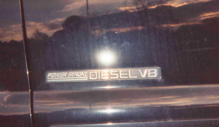 Power Stroke Diesel V8 badge on dark vehicle body