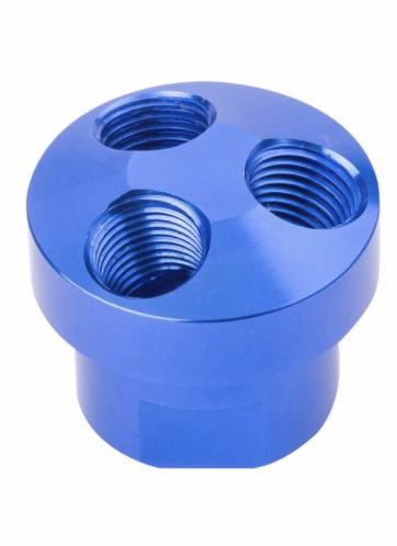 1995 Ford Bronco - A blue anodized aluminum oil filter sandwich adapter with three threaded ports is shown against a white background. The adapter has a cylin…