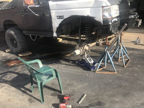 1989 Ford Bronco - A Ford F-250 truck is shown with its front suspension disassembled, indicating ongoing repair work.