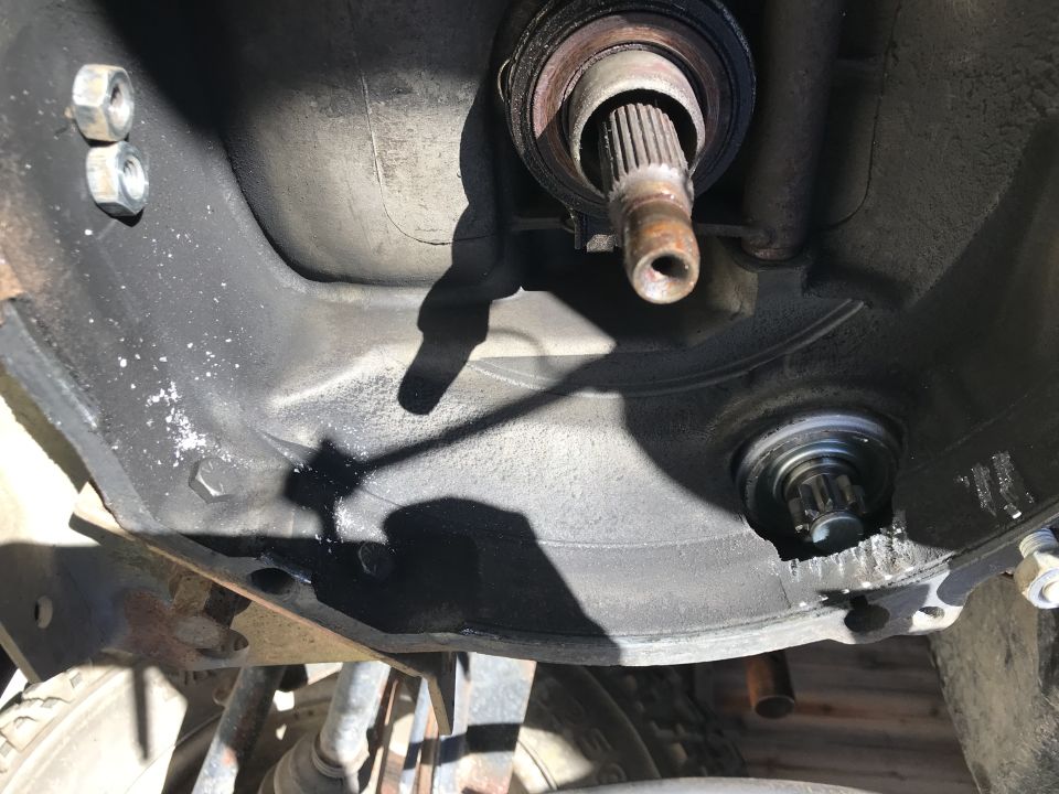 Close-up of a car's transmission bell housing with input shaft splines visible