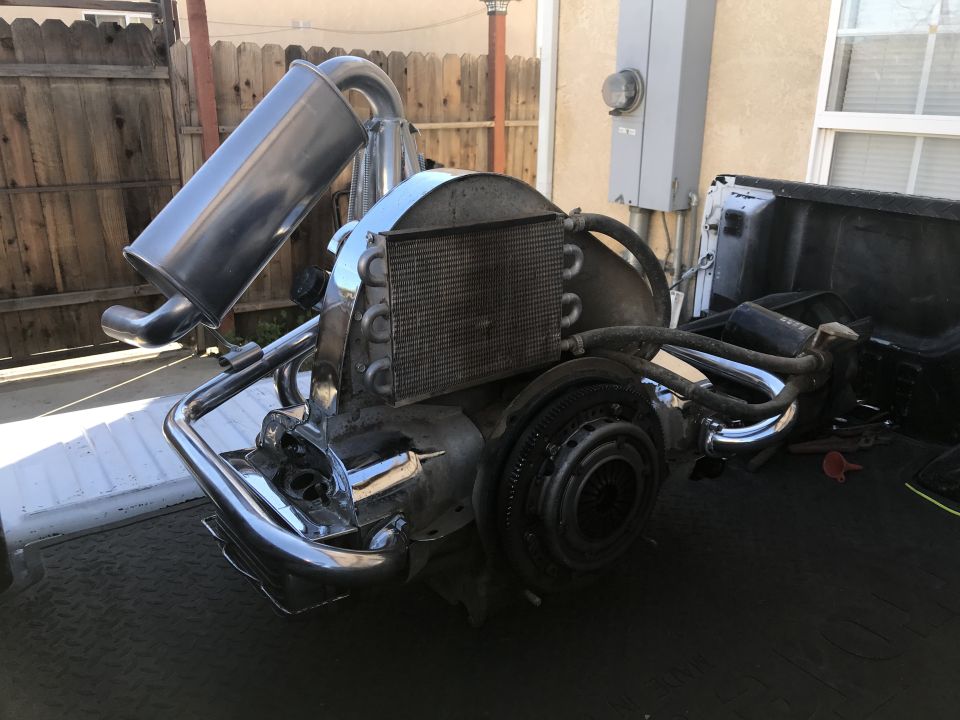 1970 Volkswagen Beetle engine with custom exhaust system and oil cooler