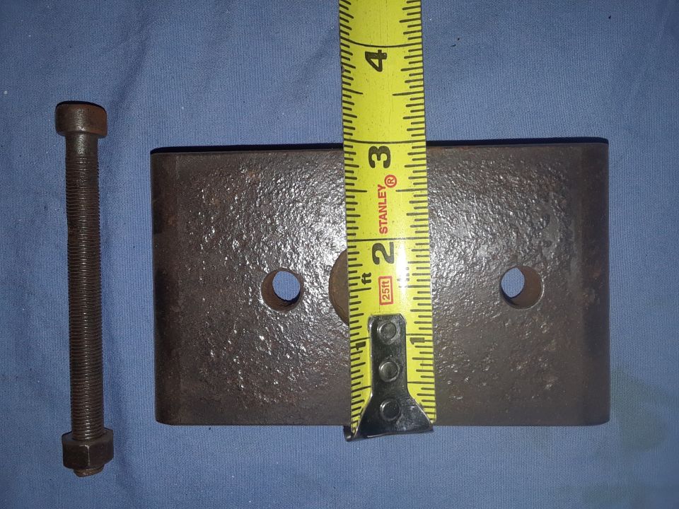 Metal plate, bolt, nut, and tape measure