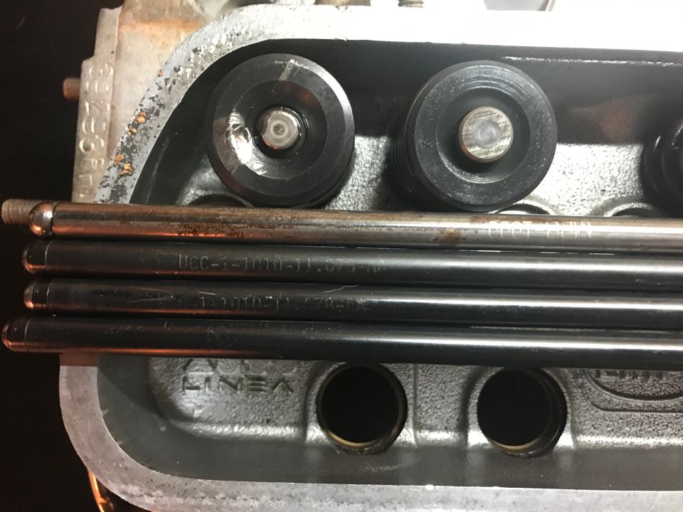 Close-up of engine cylinder head with pushrods and rocker arms