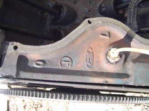 1978 Ford Bronco - Close-up of a Ford engine block showing the oval logo and cast numbers.