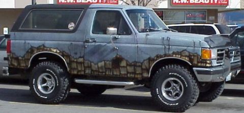 1989 Ford Bronco - This 1989 Ford Bronco features a unique mountain mural paint job on its sides.