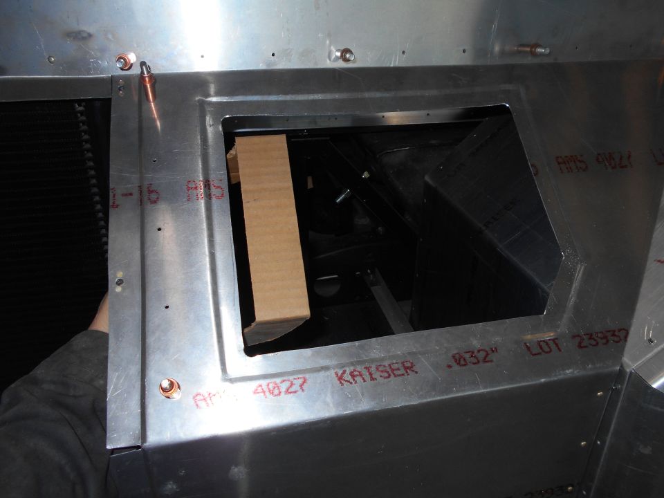 Close-up of metal interior with opening and red markings